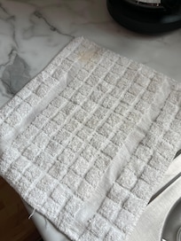 Dingy stained dish towel