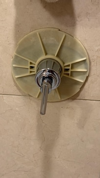 handle and cover plate of the shower coming off. Water pressure is quite low