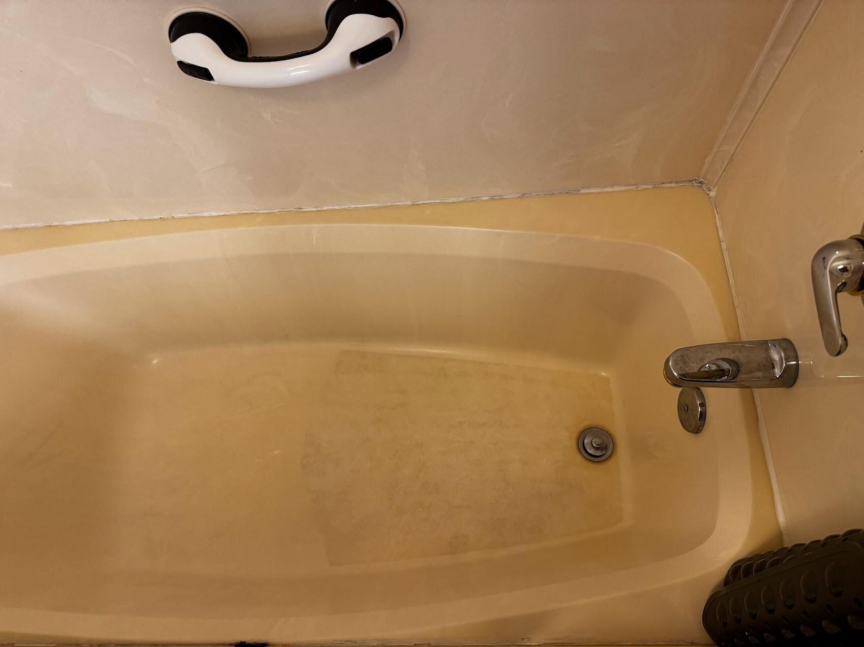 Bathtub condition at check-in.  Both bathrooms were in similar condition.