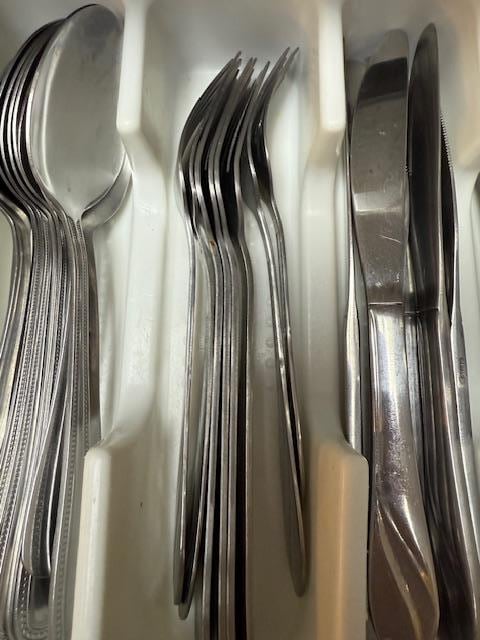 Dirty silverware put back into the drawer