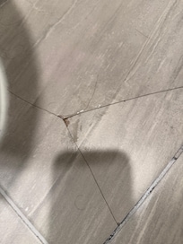 Cracked tile in bathroom