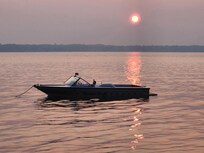 Our ski boat at sunset picture taken from the dock.