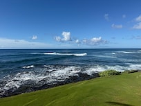 Daytime view from balcony - surfers love this beach and fishing from rocks is great!