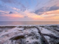 Sunset sky and beach from balcony