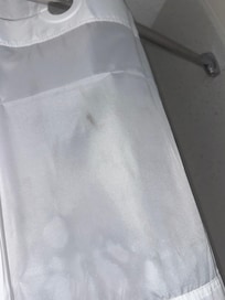 Stained shower curtain