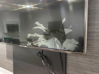 The TV in the living room was shattered. It looked like somebody had put their head through it.