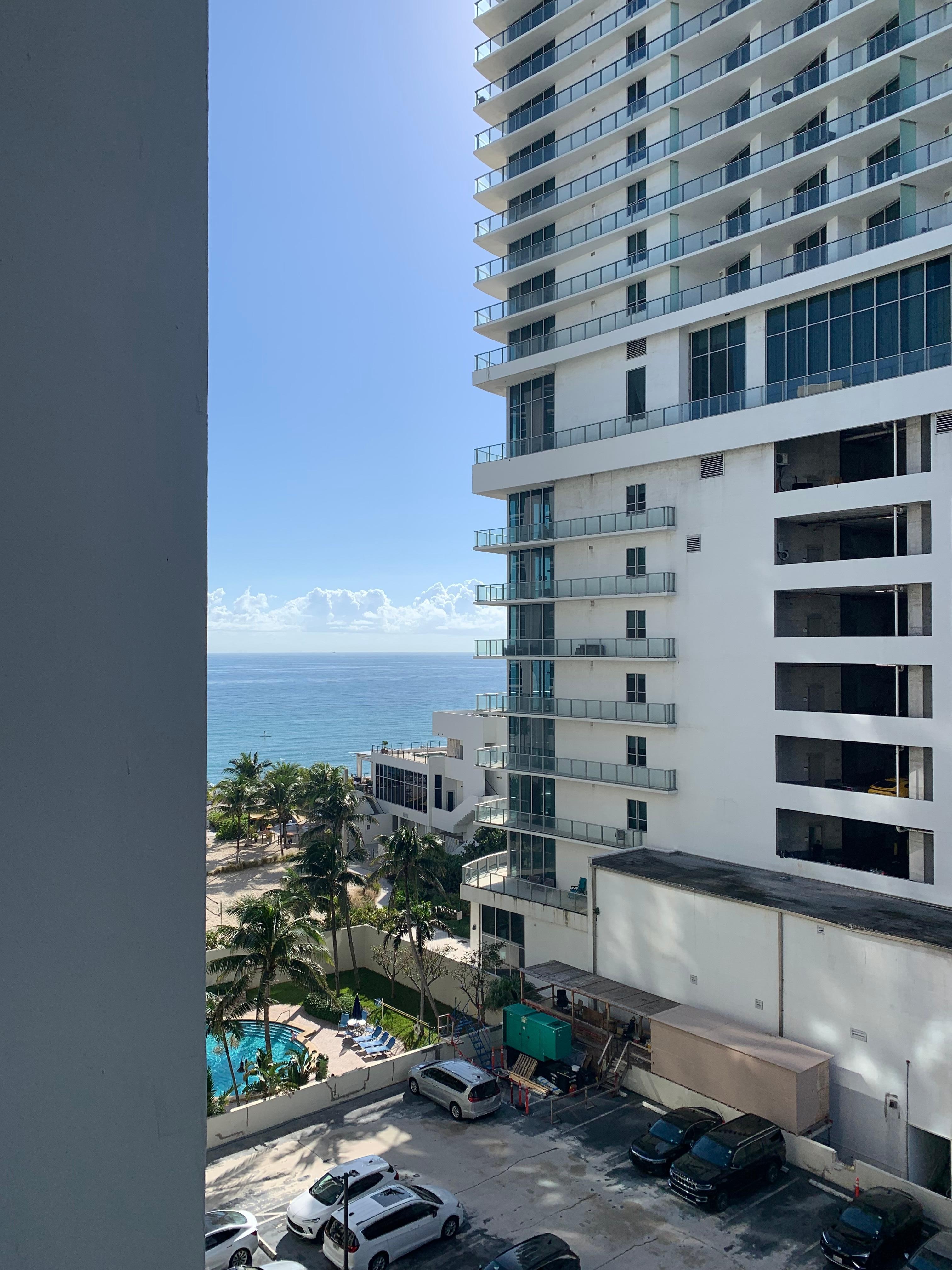 View from patio angle, patio faces next door parking garage and overlooks open parking lot of our valet & self park (when not busy) 