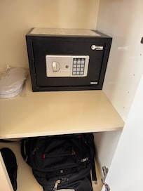 Safe attached to a moveable shelf