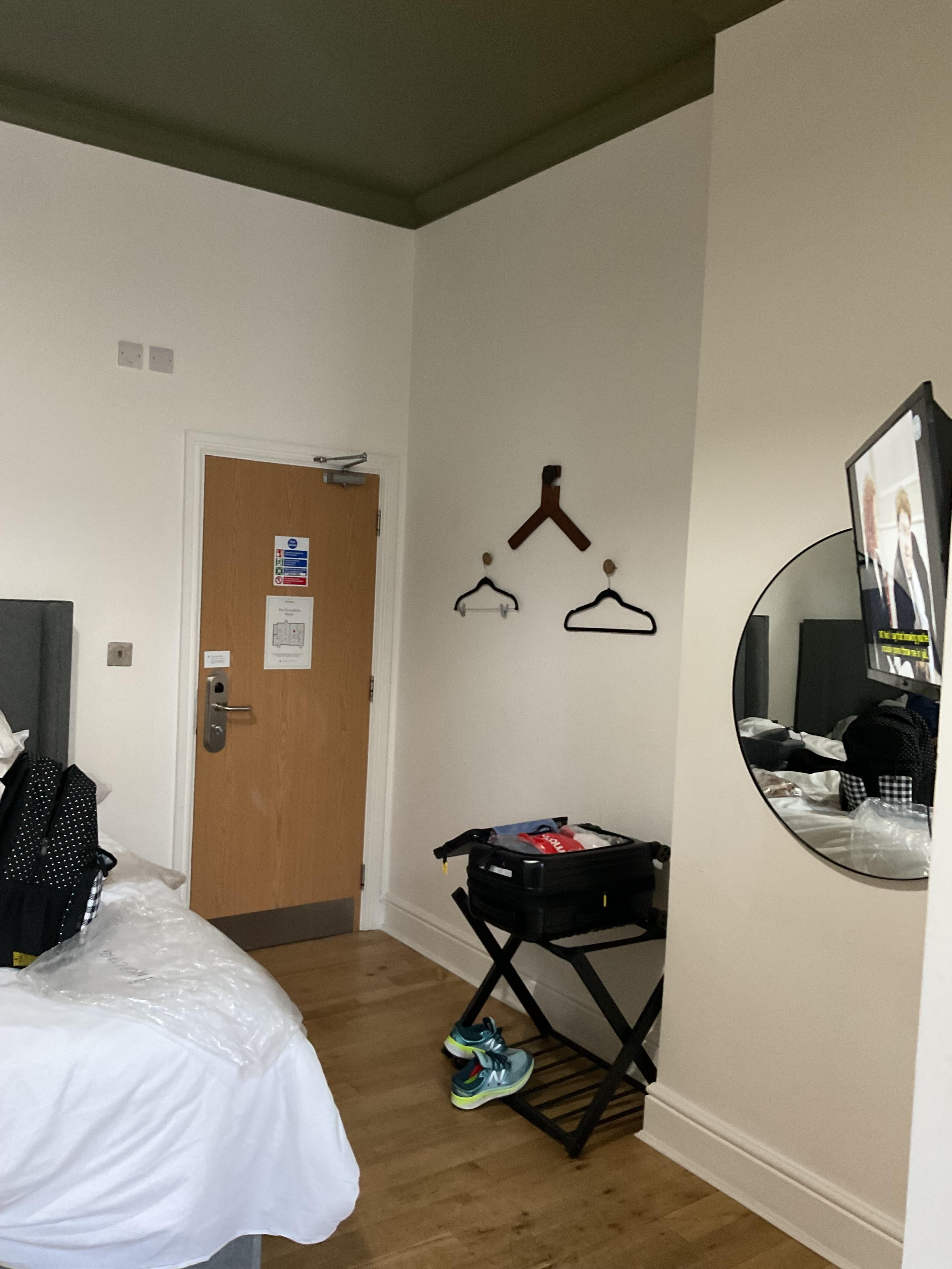 3 knobs on the wall as a wardrobe