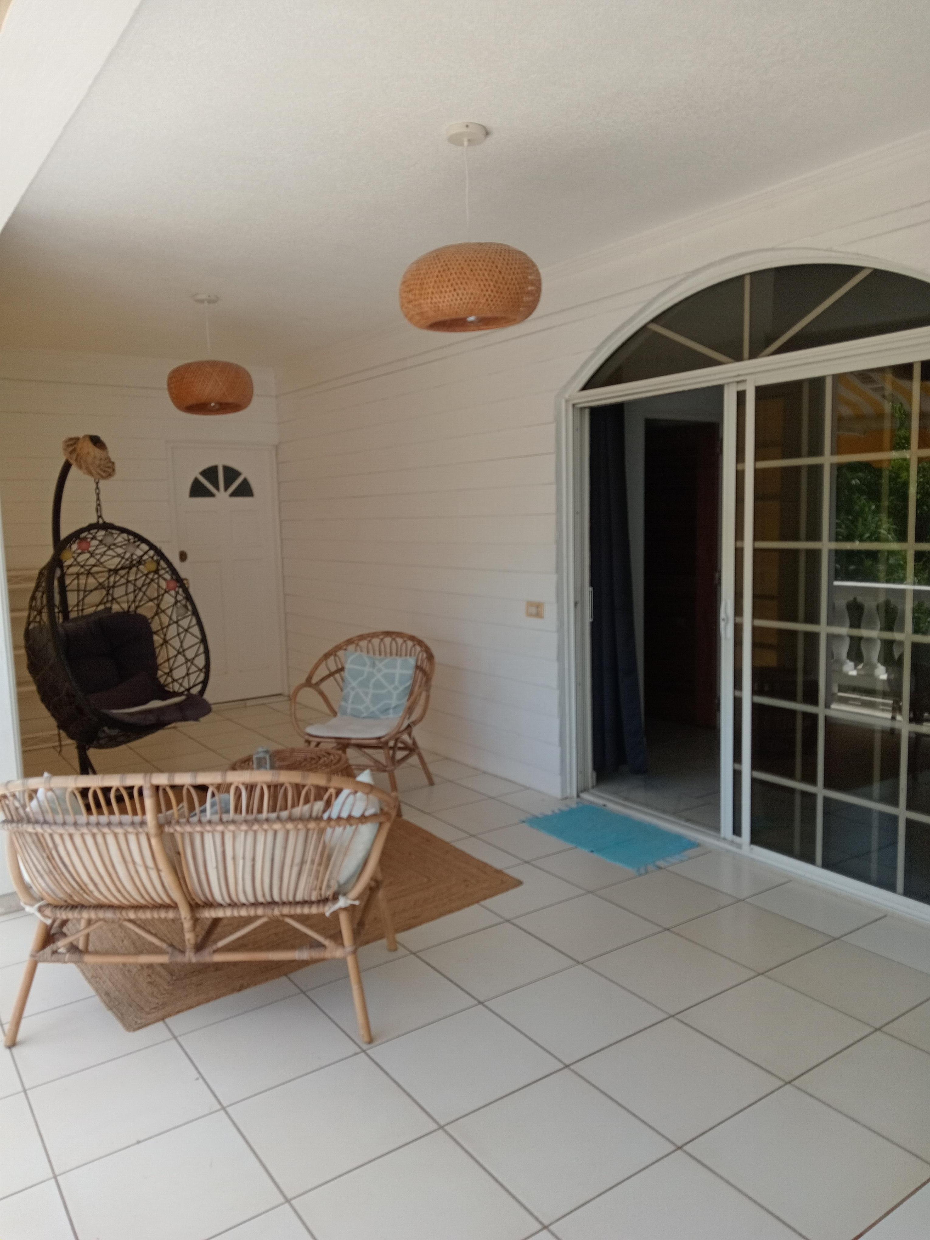 My room and the balcony with outdoor furniture.