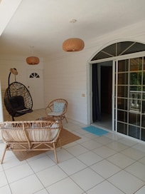 My room and the balcony with outdoor furniture.