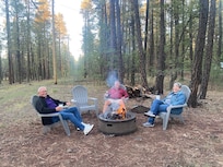 A great fire pit in the backyard with ample stock of wood.  Beautiful scenery