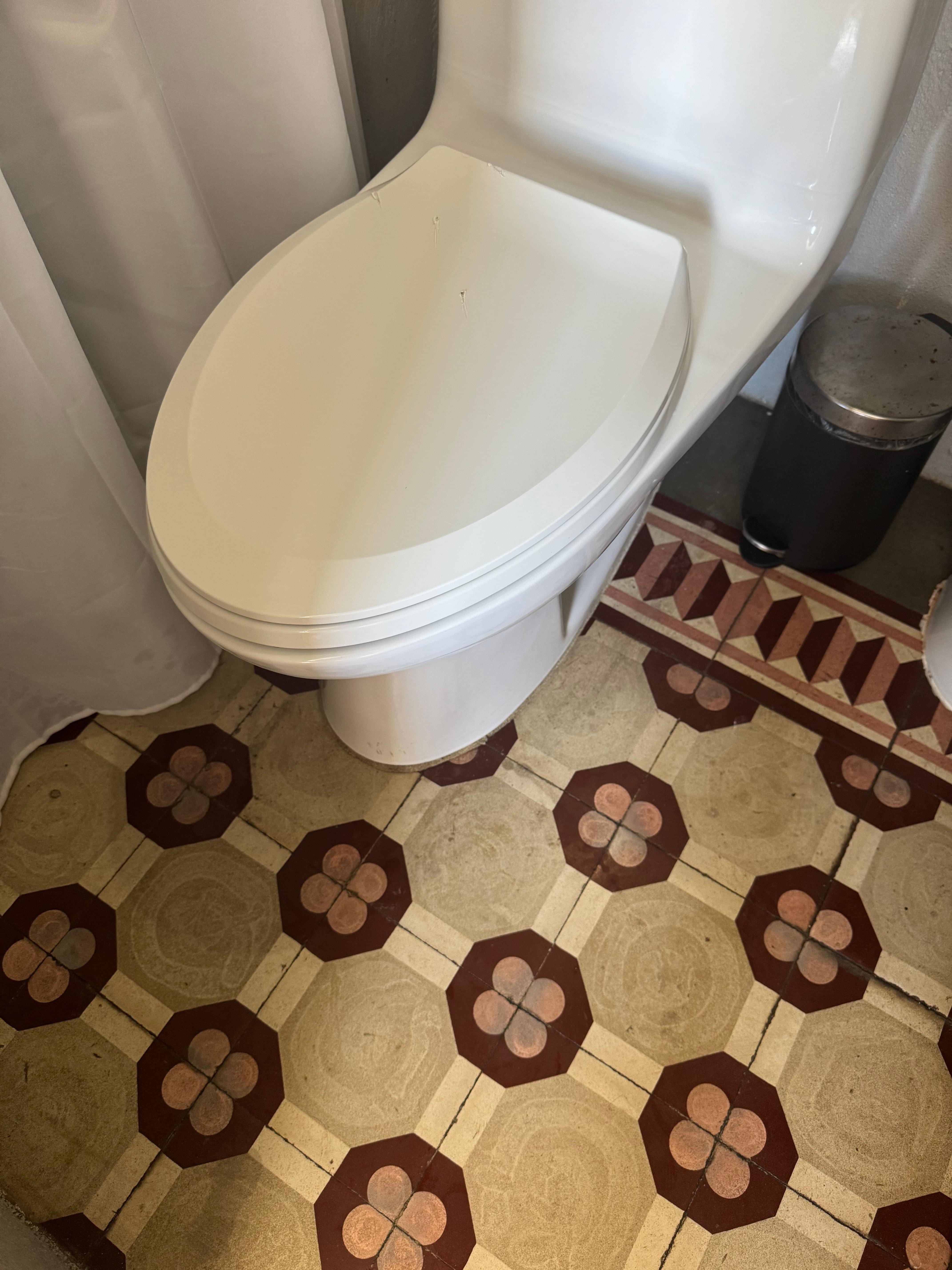 Lots a splatter around the toilet 