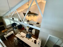 The view of the kitchen from the loft.