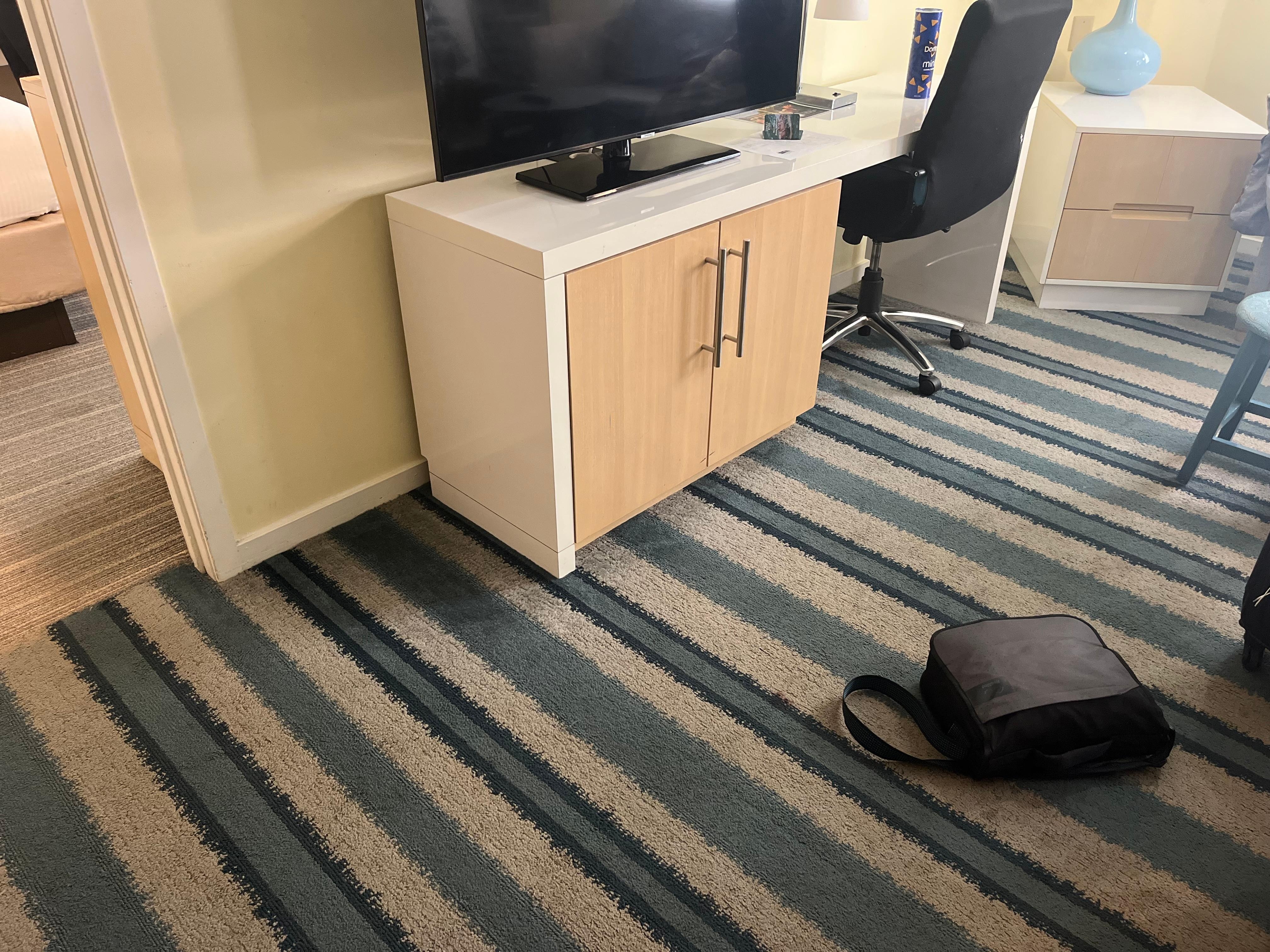 Odd furniture covers. Worn. Carpet stains everywhere.