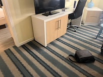 Odd furniture covers. Worn. Carpet stains everywhere.