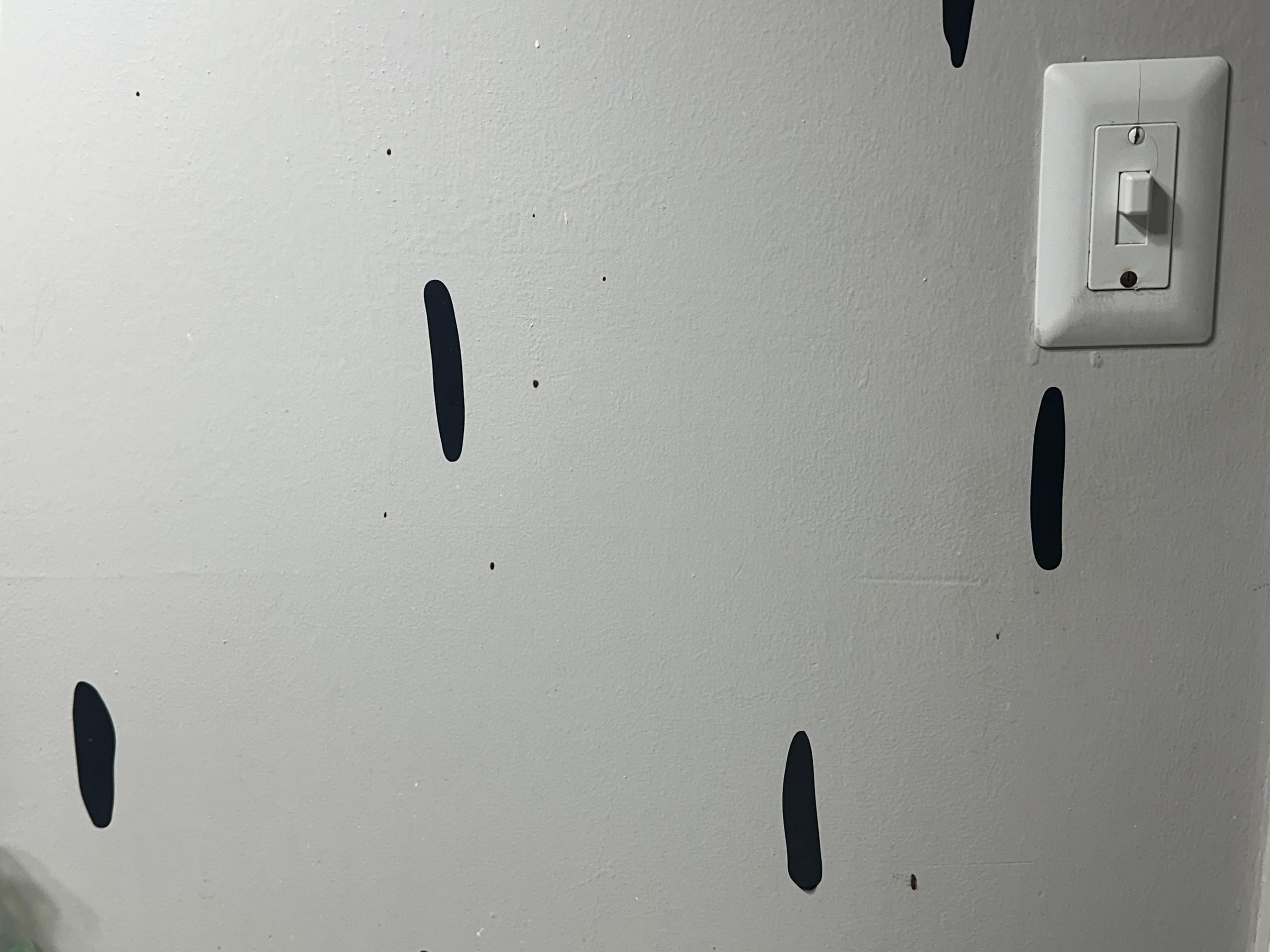 Dirty stuff splattered on wall. Maybe blood? 