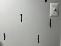 Dirty stuff splattered on wall. Maybe blood?