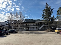 The parking lot is safely in the back.