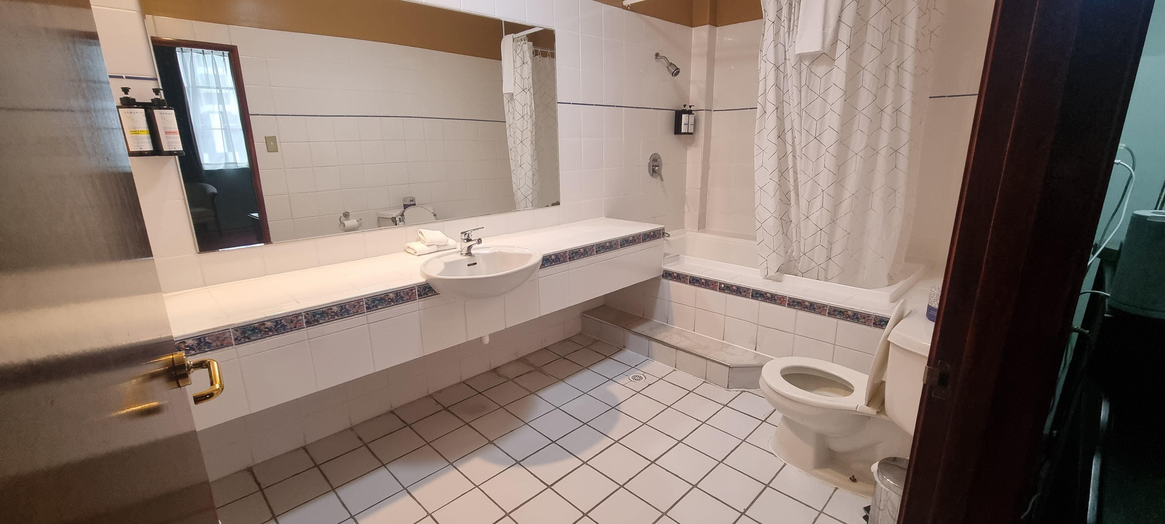 Shower over bath, 2 steps to get in, have to be very careful as its very slippery upon exiting the tub