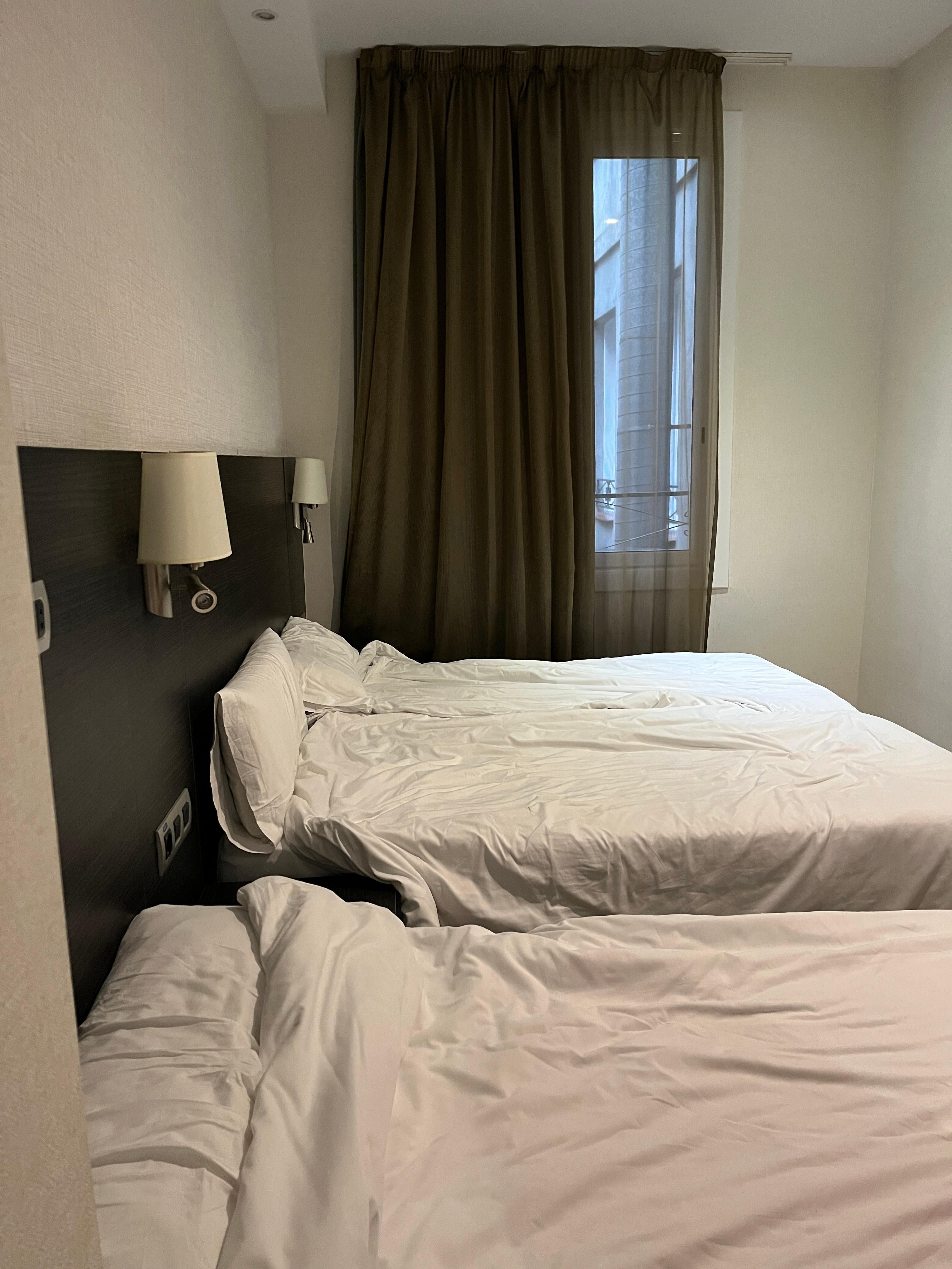 Basic 3-bed room for 3 adults. This is the extent of the room, plus a bathroom with a rather impractical frosted glass door that had gaps open to the room. Beds are comfortable; tv and desk and small closet area with safe.