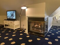 The rooms has a fireplace