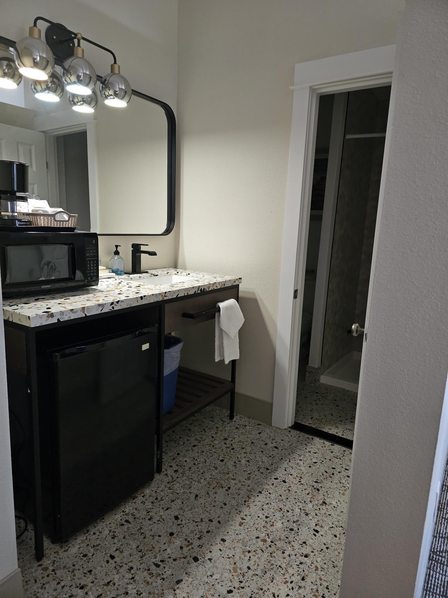 Cute updated vanity area with mini fridge and microwave.  Loved the coffee cups!