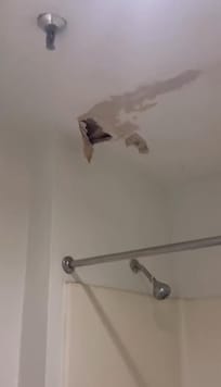 Hole in restroom on ceiling