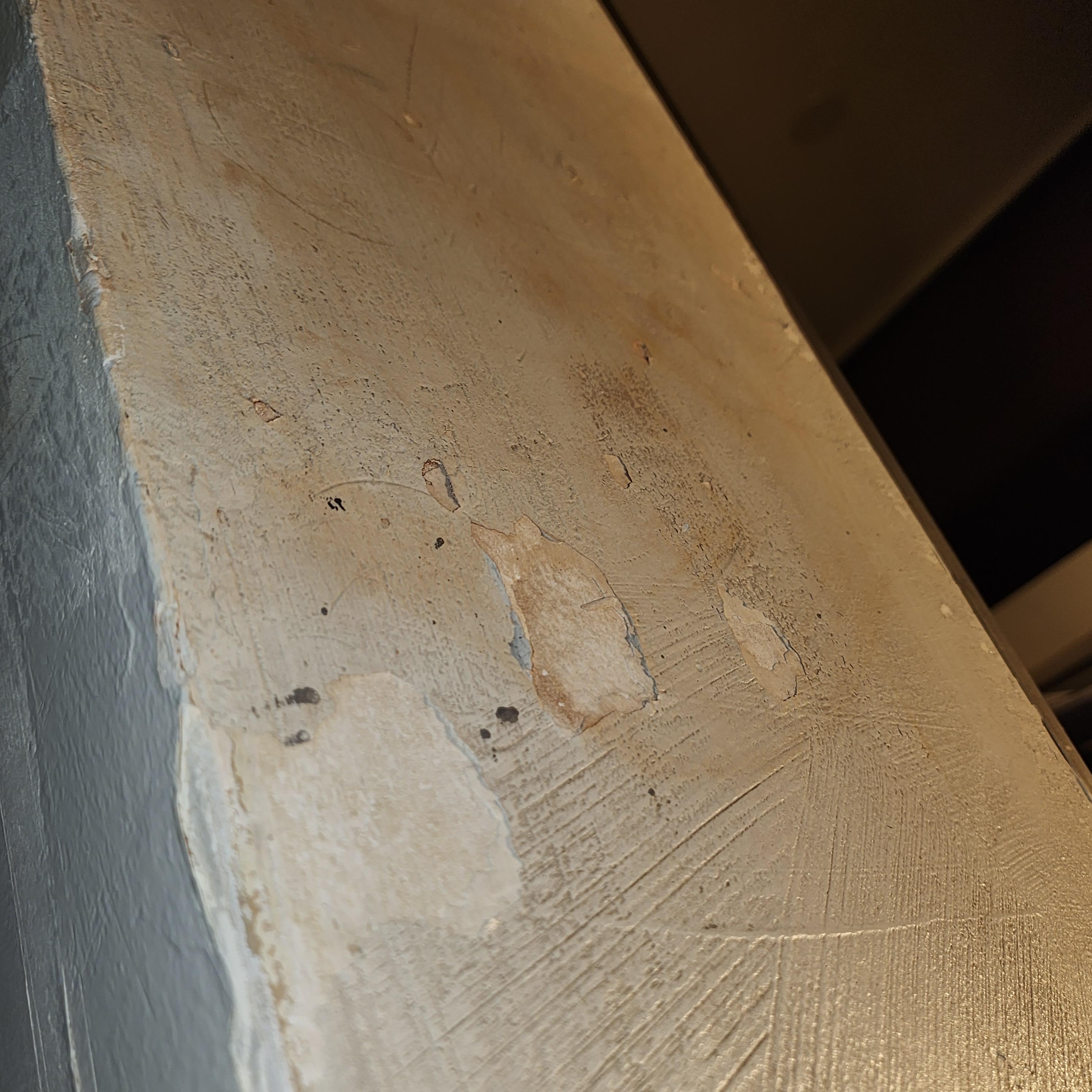 Water damaged and paint falling off.