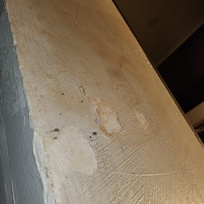 Water damaged and paint falling off.