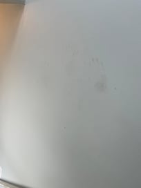 Handprints on stairs going upstairs