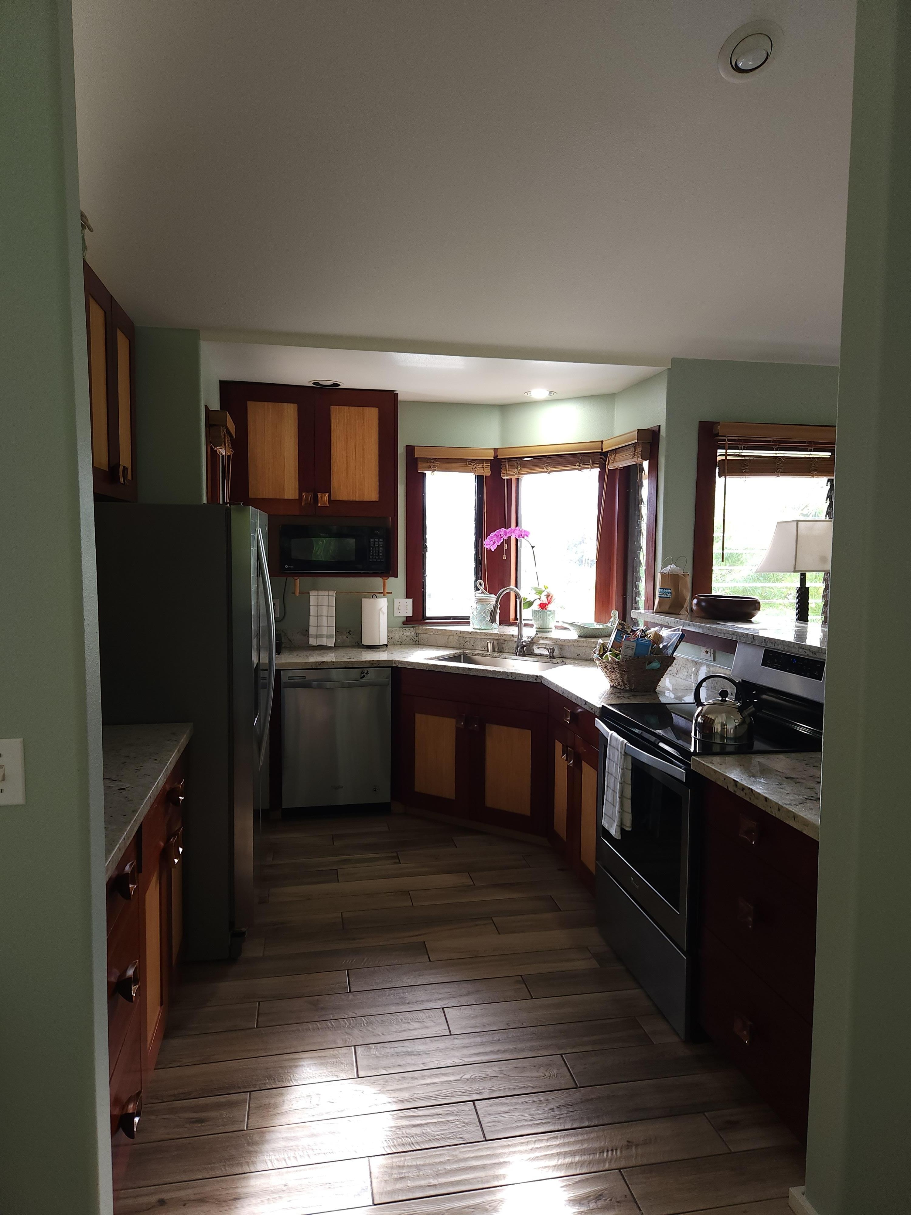 Spacious and well equipped kitchen with beautiful wood cabinets