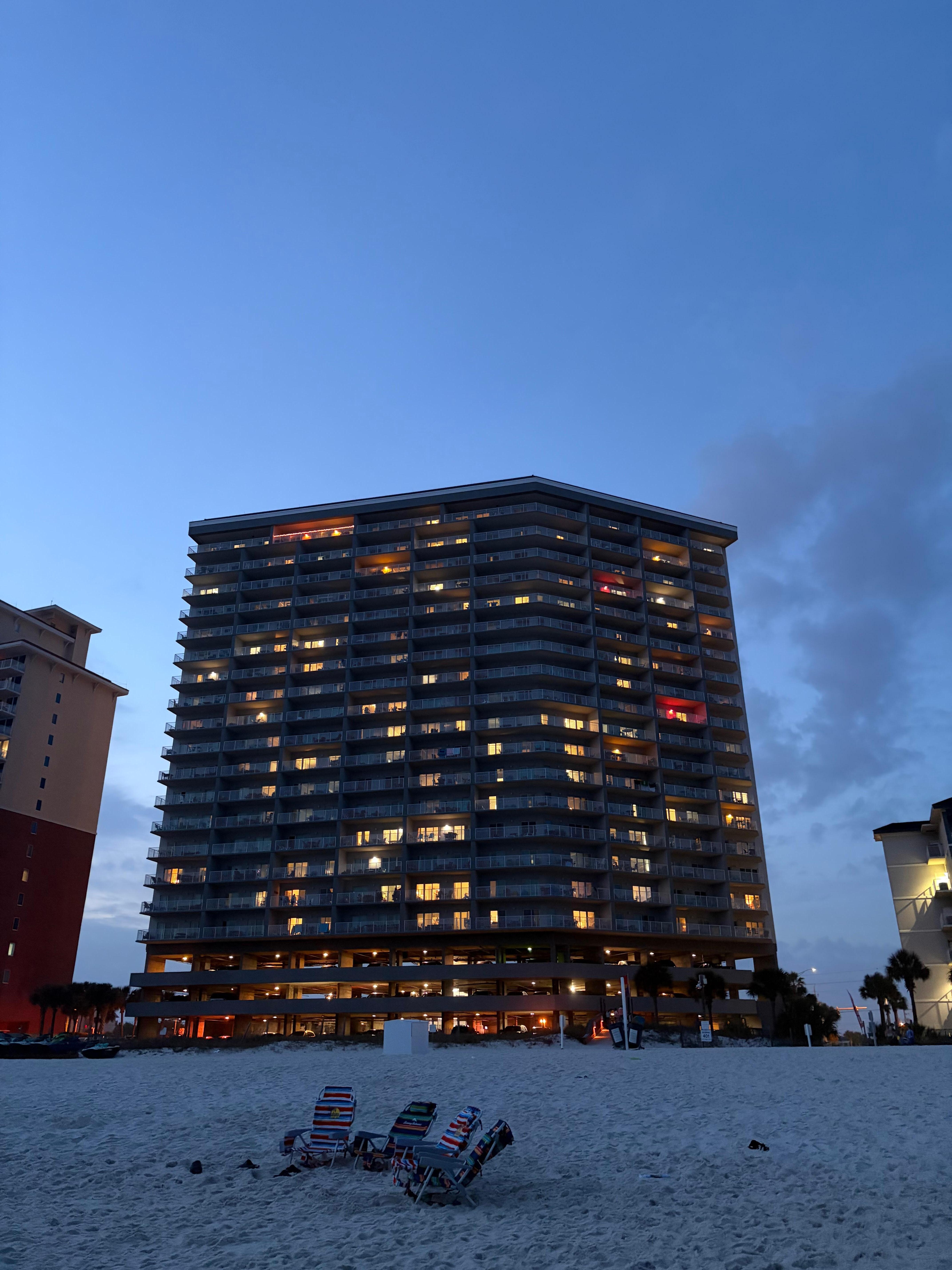 The condo is the third floor from the top with a red light on the porch.