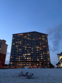 The condo is the third floor from the top with a red light on the porch.