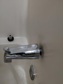Bathtub faucet not flush with the wall.