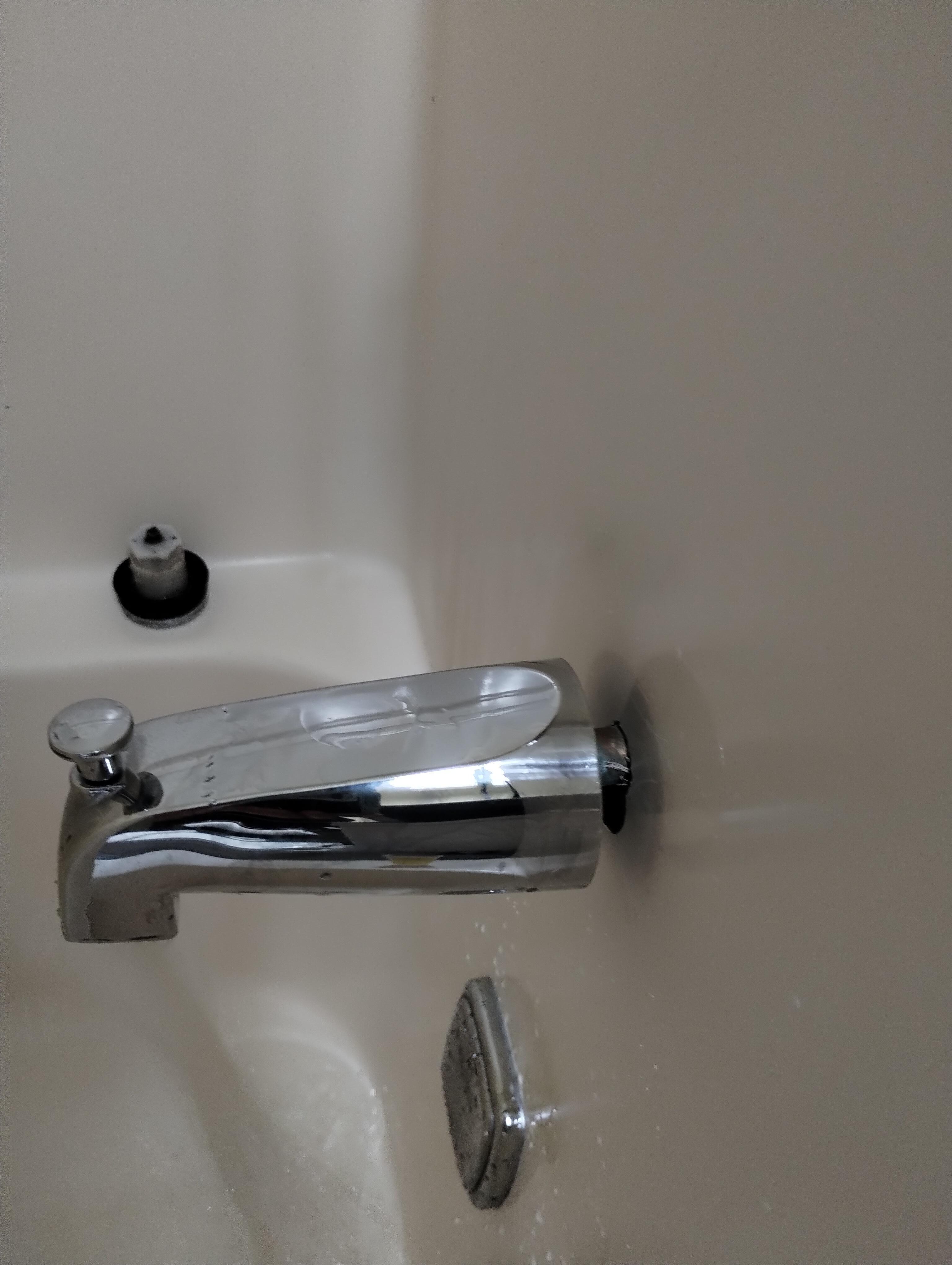 Bathtub faucet not flush with the wall.