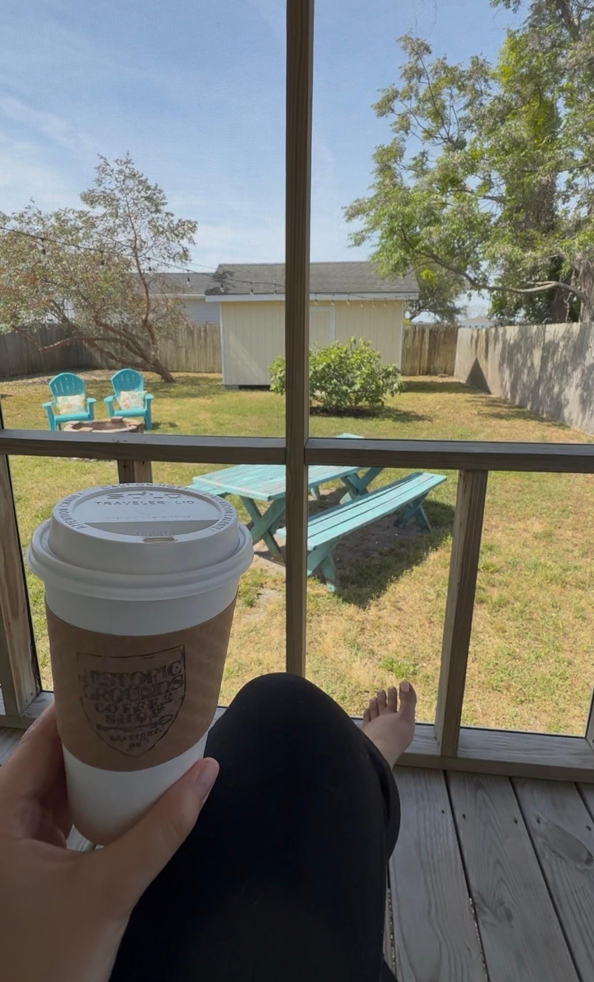 Enjoying my coffee from nearby Historic Grounds while rocking on the screened-in porch was amazing!