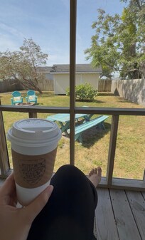 Enjoying my coffee from nearby Historic Grounds while rocking on the screened-in porch was amazing!