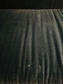 Dirty velvet couch in our room.