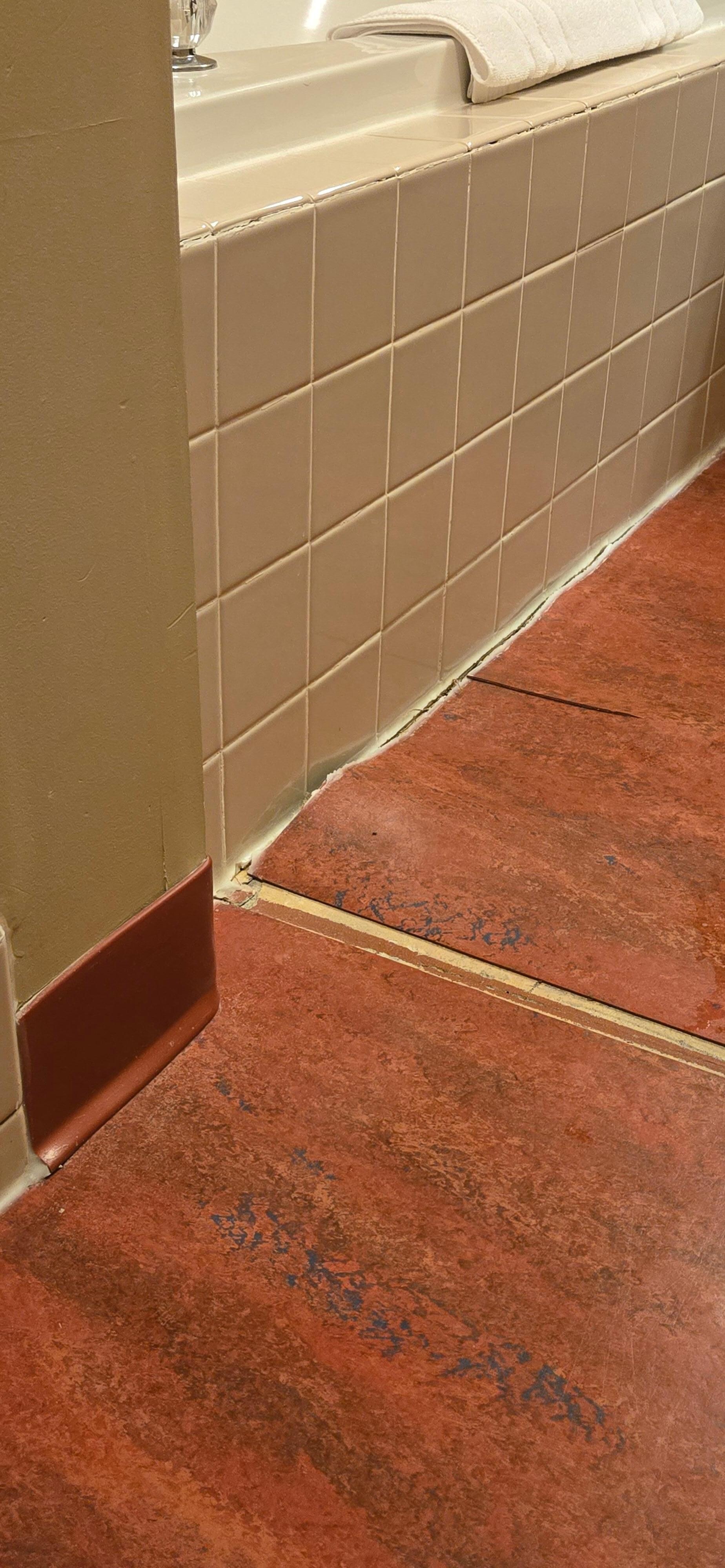 Lifted flooring in bathroom 