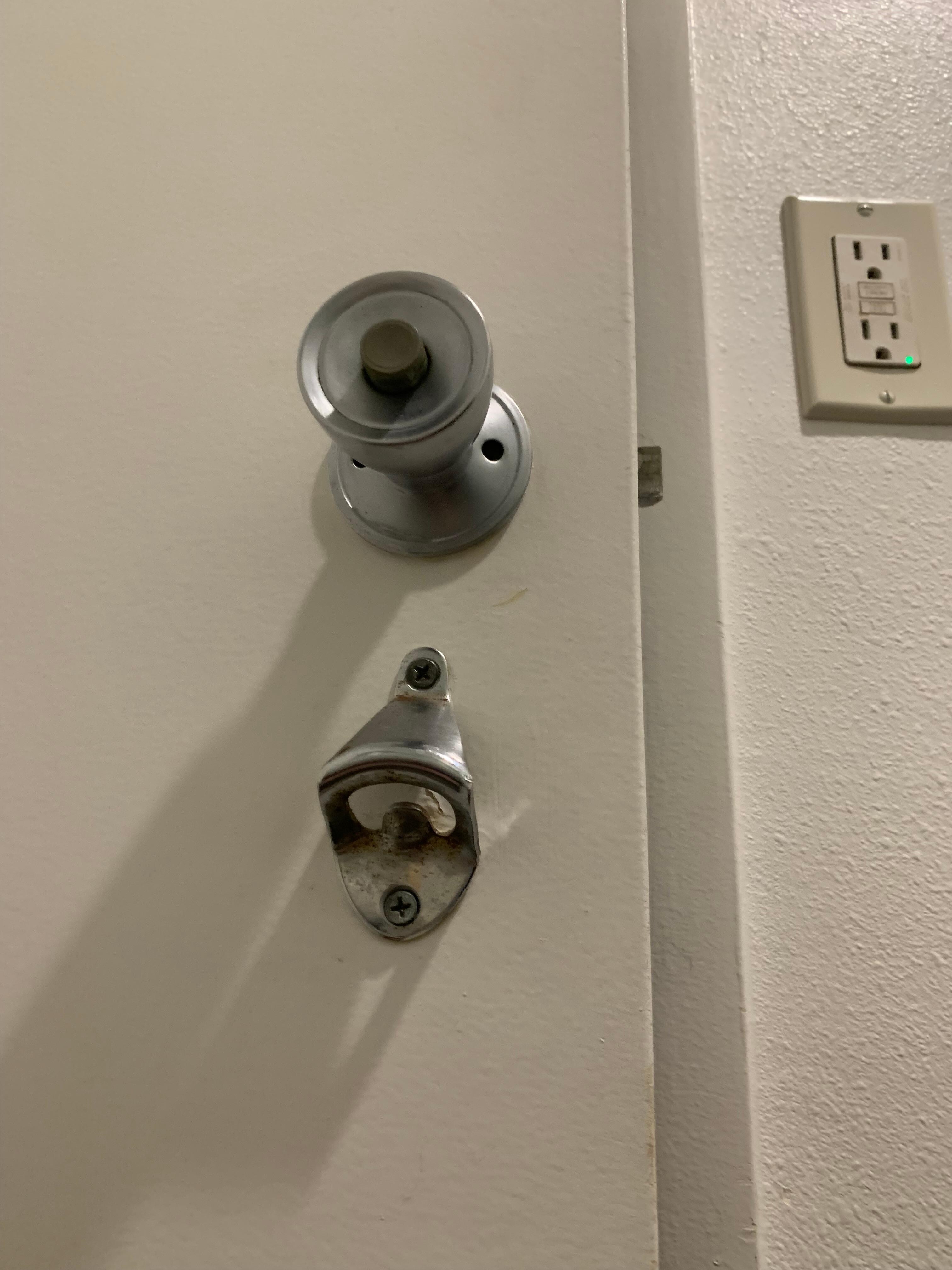 Handy bathroom mounted bottle opener. Lol