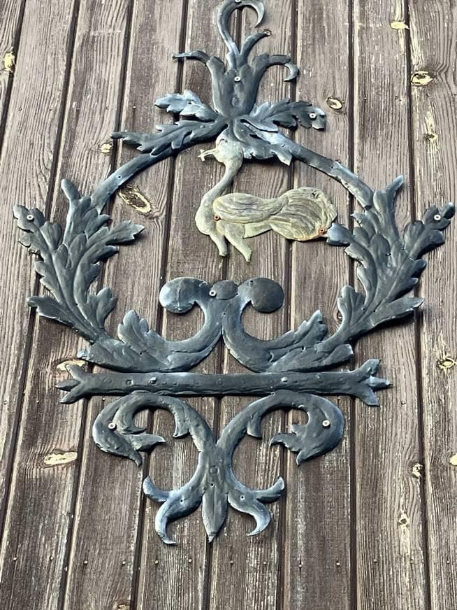 Intriguing bird on a panel in the walled garden