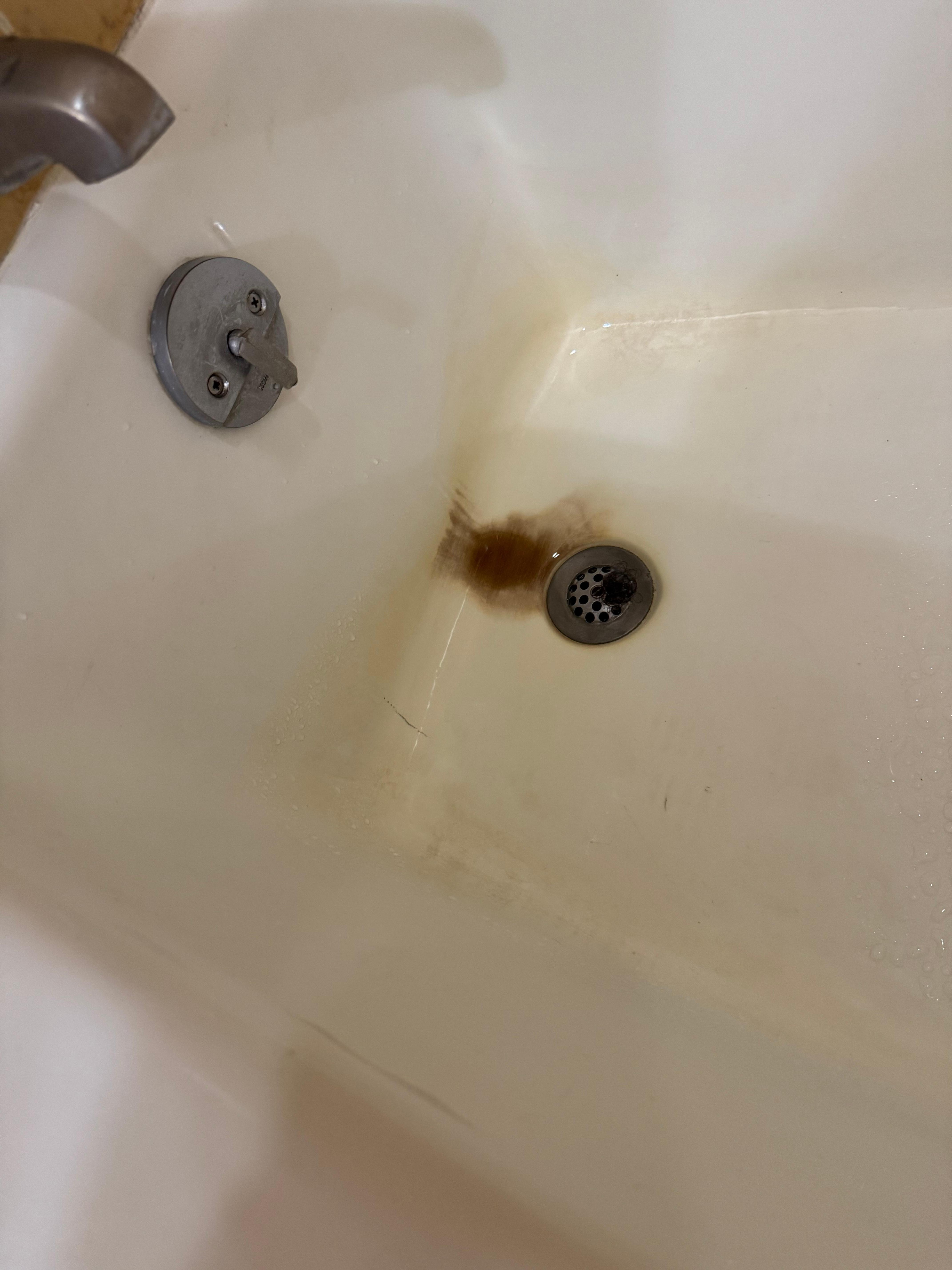 The tub had soap scum and stains all over it