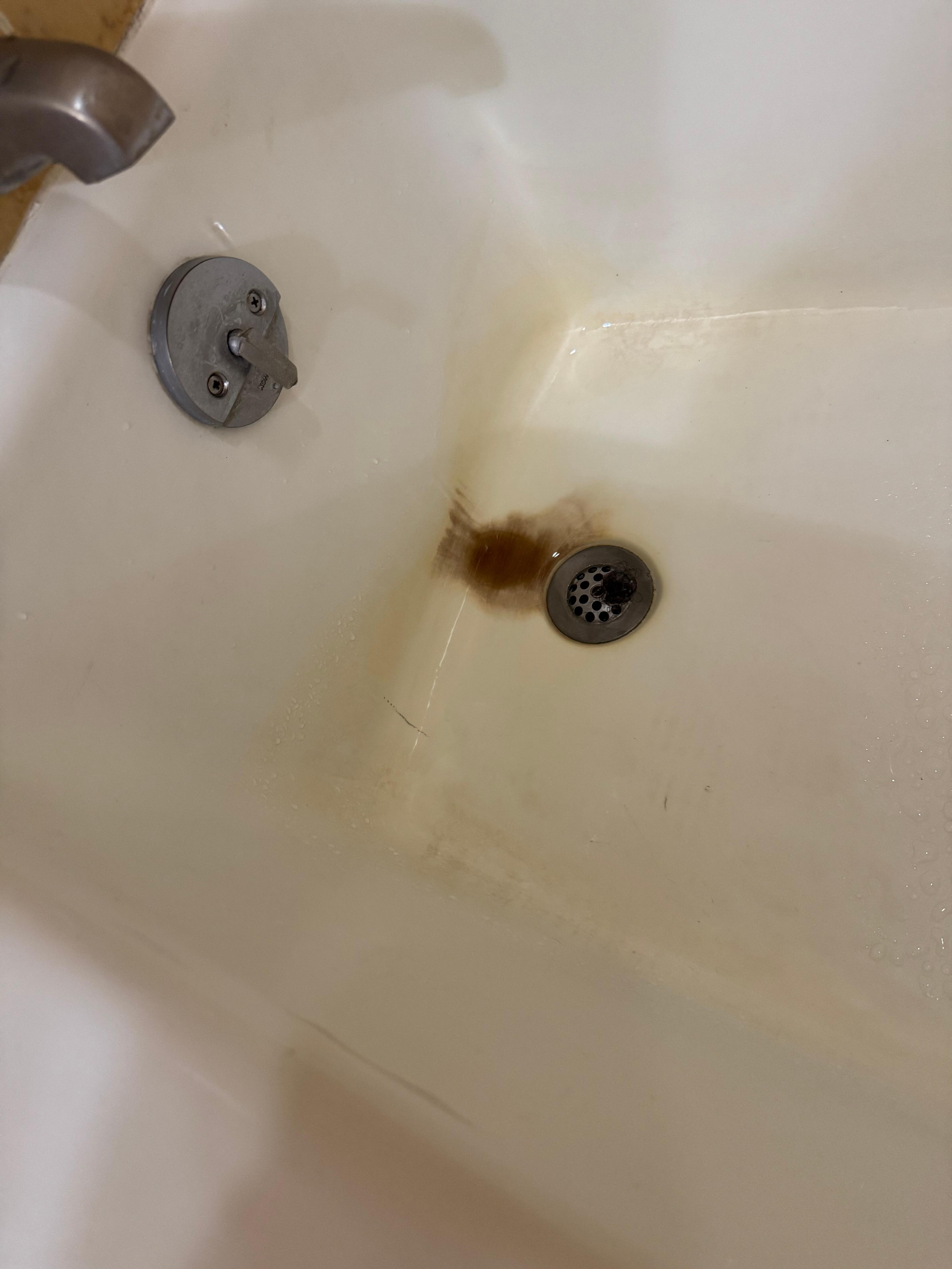 The tub had soap scum and stains all over it
