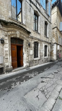 Side of hotel (our ground floor room looks onto the street though these windows)