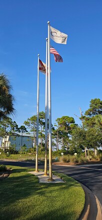 Flags in front of clubhouse/pool area.