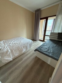 One of two bedrooms. Well lighted, clean