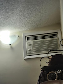A/C at the top of the wall, hubby needed to use a chair to change the temp. Then u had to flip a switch across the room to turn on