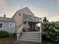 Balcony and deck in back of cottage