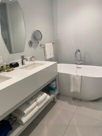 Lovely bath with huge tub and walk-in shower.